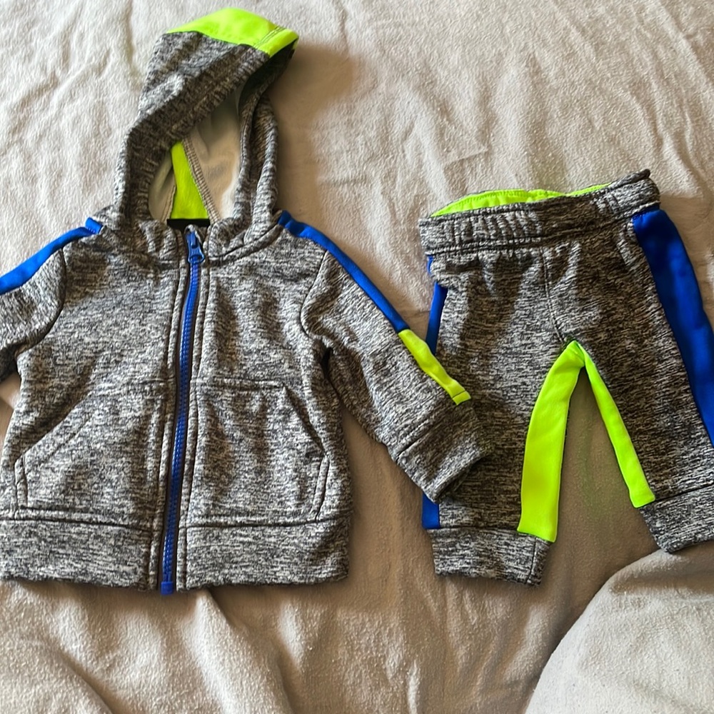 Little zipper hoodie with pockets and pants .